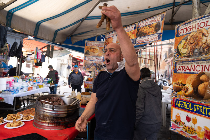 mr schillaci and his abbannìata (in his hands: lamb innards)
